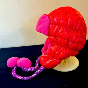 USED plushy, shiny orange hat with soft pink trim. A quilty, magenta inside.